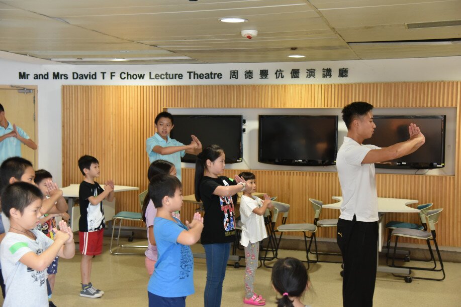 Children learn martial arts at the child development workshop. 