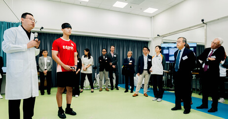 An EdUHK student athlete demonstrates equipment in the Human Performance Laboratory, covering the fields of sports biomechanics and sports physiology