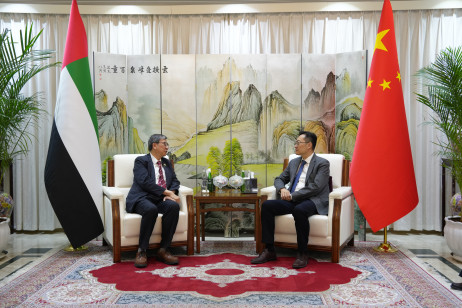 Professor John Lee Chi-Kin (left) is received by Minister Zhao Liang, Chargé d'affaires a.i. of the Chinese Embassy in the United Arab Emirates (right)