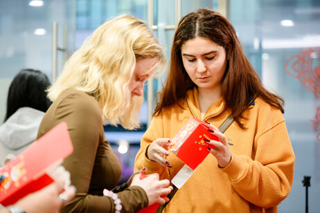 Students prepare traditional sweet boxes