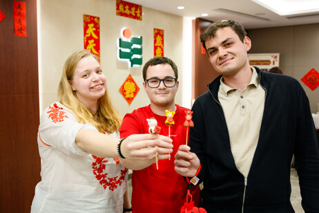 International students with the dough figurines they crafted