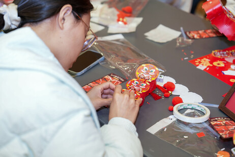 Students craft handheld lanterns with horse-themed designs