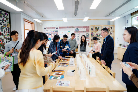 JC InnoPower Education Fellows, school leaders, and coaches view students’ artworks