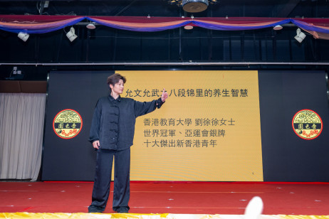 Miss Liu Xuxu, World Wushu Champions and Asian Games silver medalist, presents her keynote remarks at the symposium