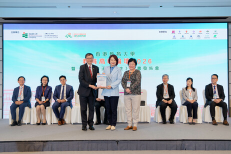 Ms Imma Ling, accompanied by Professor John Lee, presents a certificate of appreciation to Hon Professor Starry Lee Wai-king