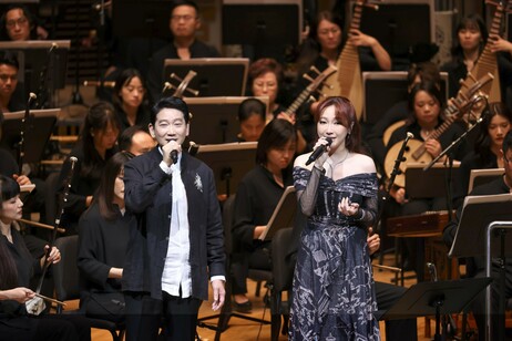 Guest vocalists Mr Raymond Young Lap moon and Ms Mischa Ip Hau-lam perform the classic martial arts songs in duet