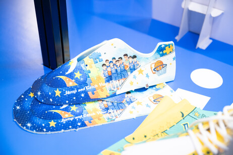 Participants create designs using both hand-drawing techniques and AI tools, developing signature sneakers for characters from the inclusive-themed novel Jump & Catch Your Sky