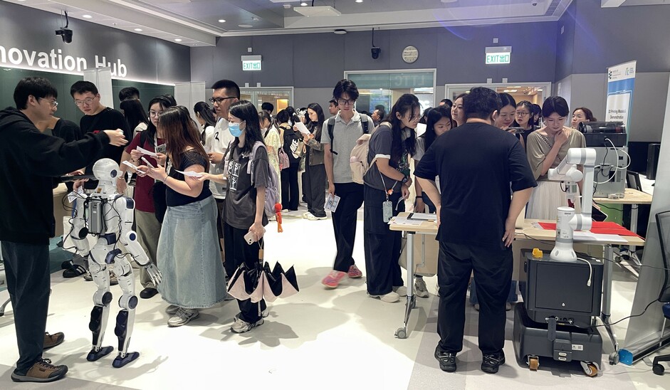 EdUHK staff and students observe demonstrations of the humanoid robot and the interactive robotic arm at the LTTC Roadshow 